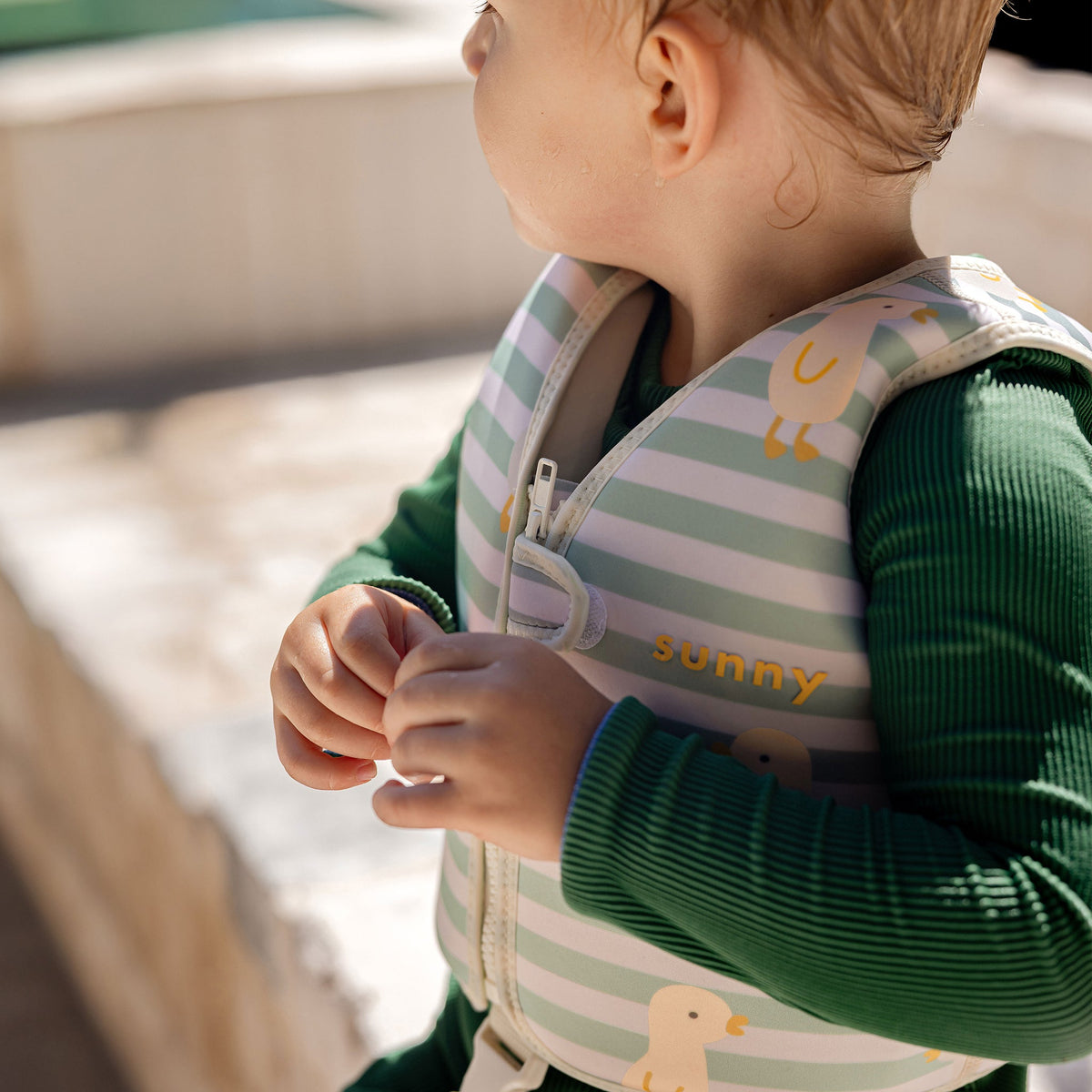 SUNNYLIFE Kids Swim Vest Dex the Duck Multi lifestyle shot