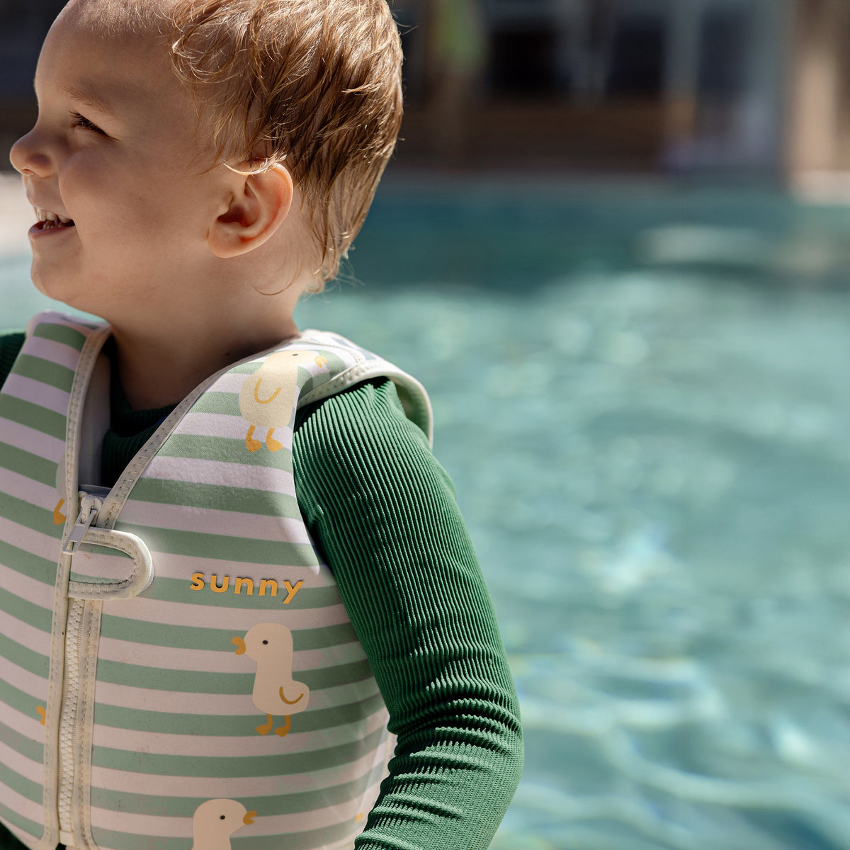 SUNNYLIFE Kids Swim Vest Dex the Duck Multi lifestyle shot