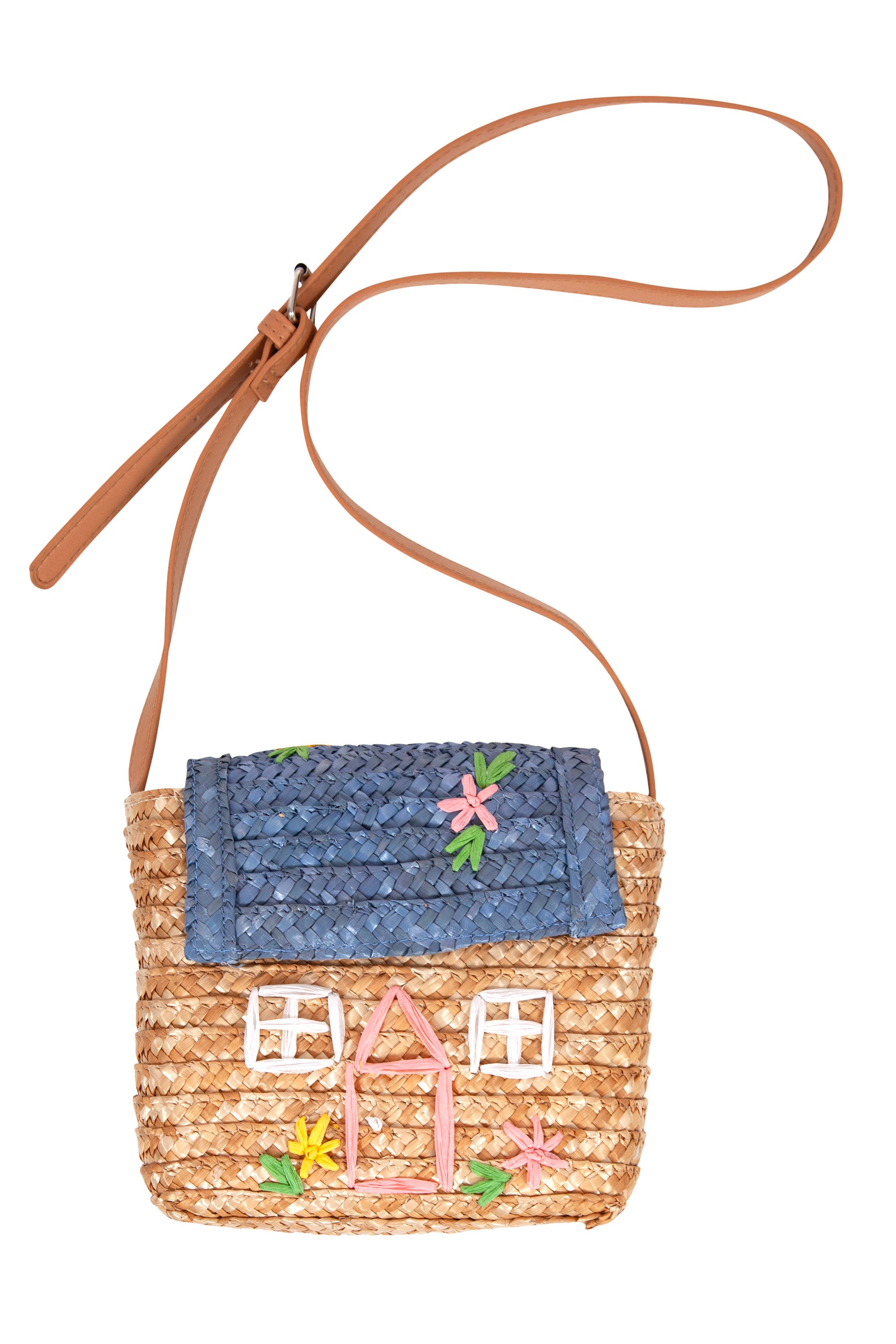 The La Maison Straw Bag Blue by ACORN KIDS features a charming and distinctive design with a blue roof flap, a pink center door, and two white windows on its raffia straw body adorned with colorful flowers. The tan leather strap is adjustable for perfect crossbody wear.