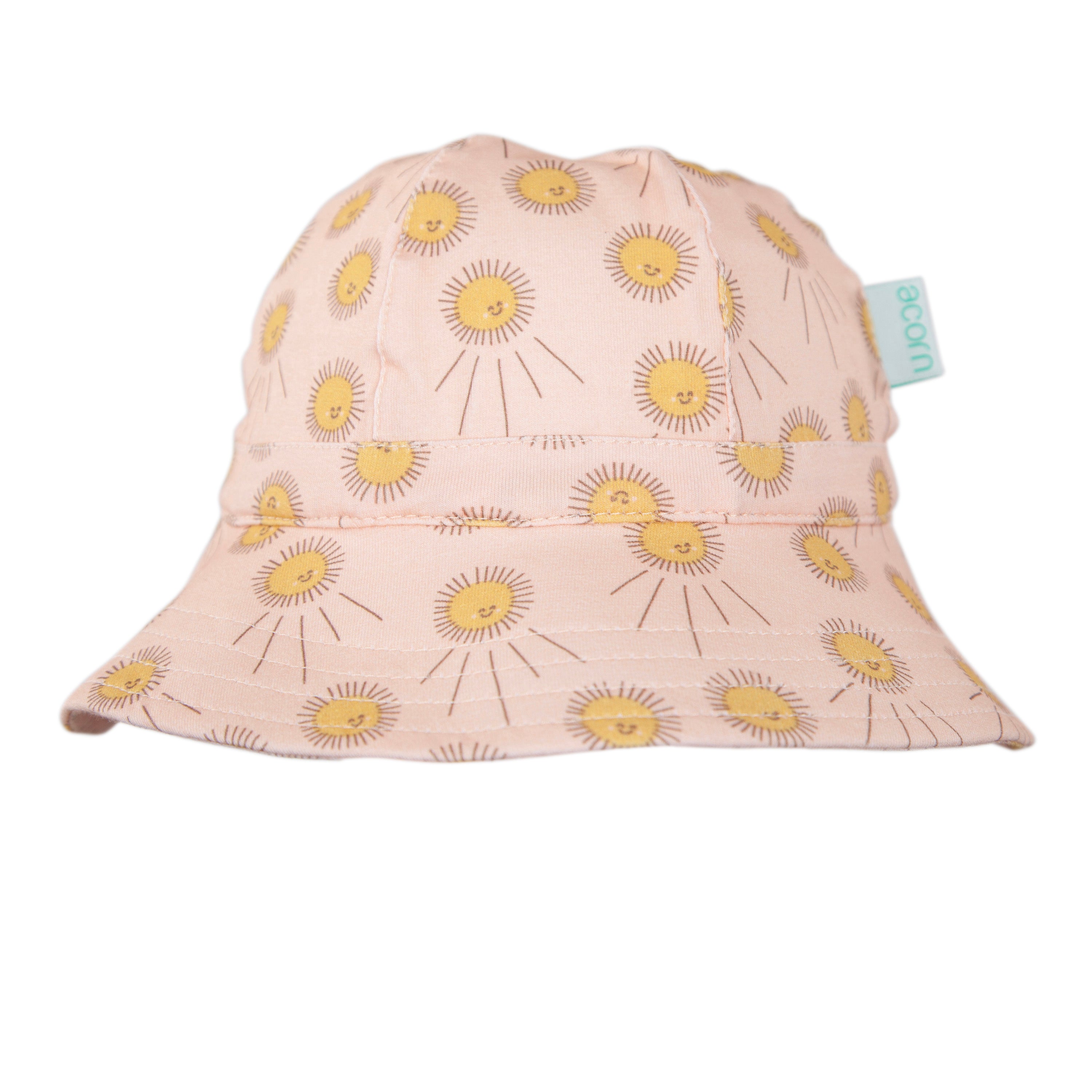 The Acorn Kids - Sunshine Stretch Cotton Wide Brim Sunhat by ACORN KIDS features a pink design with yellow dandelion-like flowers, a blue-green side tag, UPF50+ protection, and is made from stretch cotton for comfort, shown on a white background.