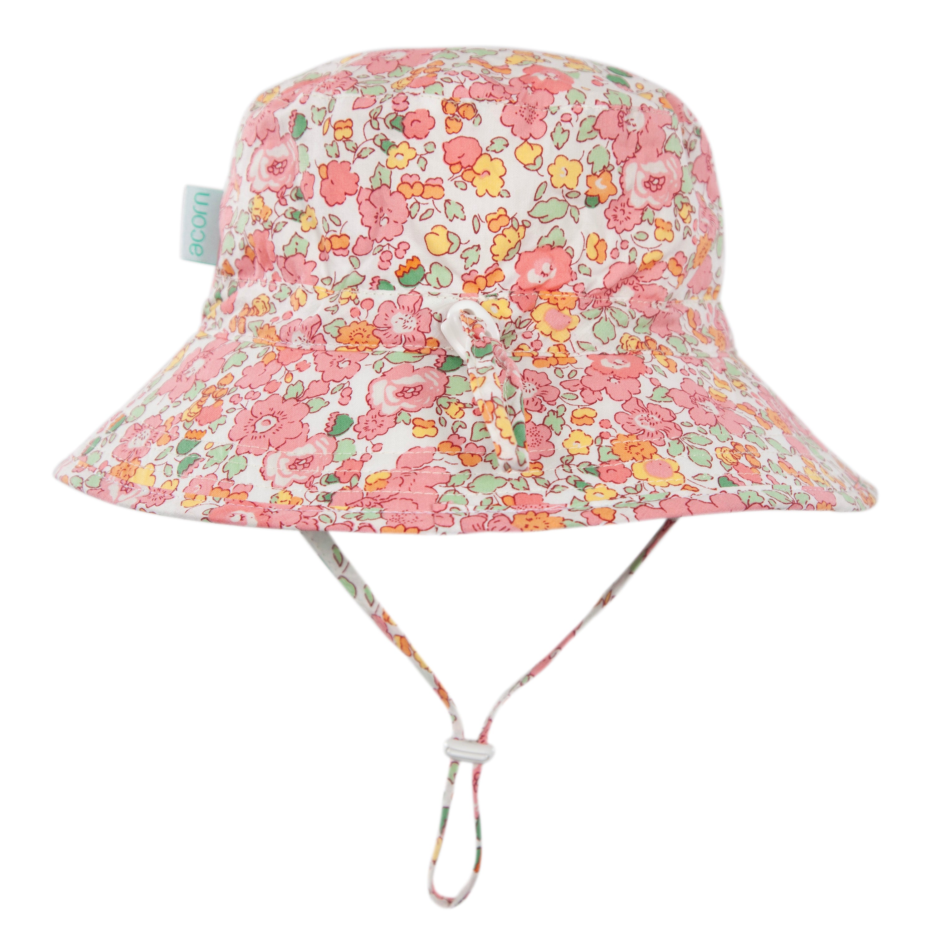 The Acorn Kids Tessa Broad Brim Bucket Hat by ACORN KIDS features UPF50+ sun protection, wide brim, adjustable chin strap with white drawstring, and a vibrant pink, yellow, and orange floral pattern.