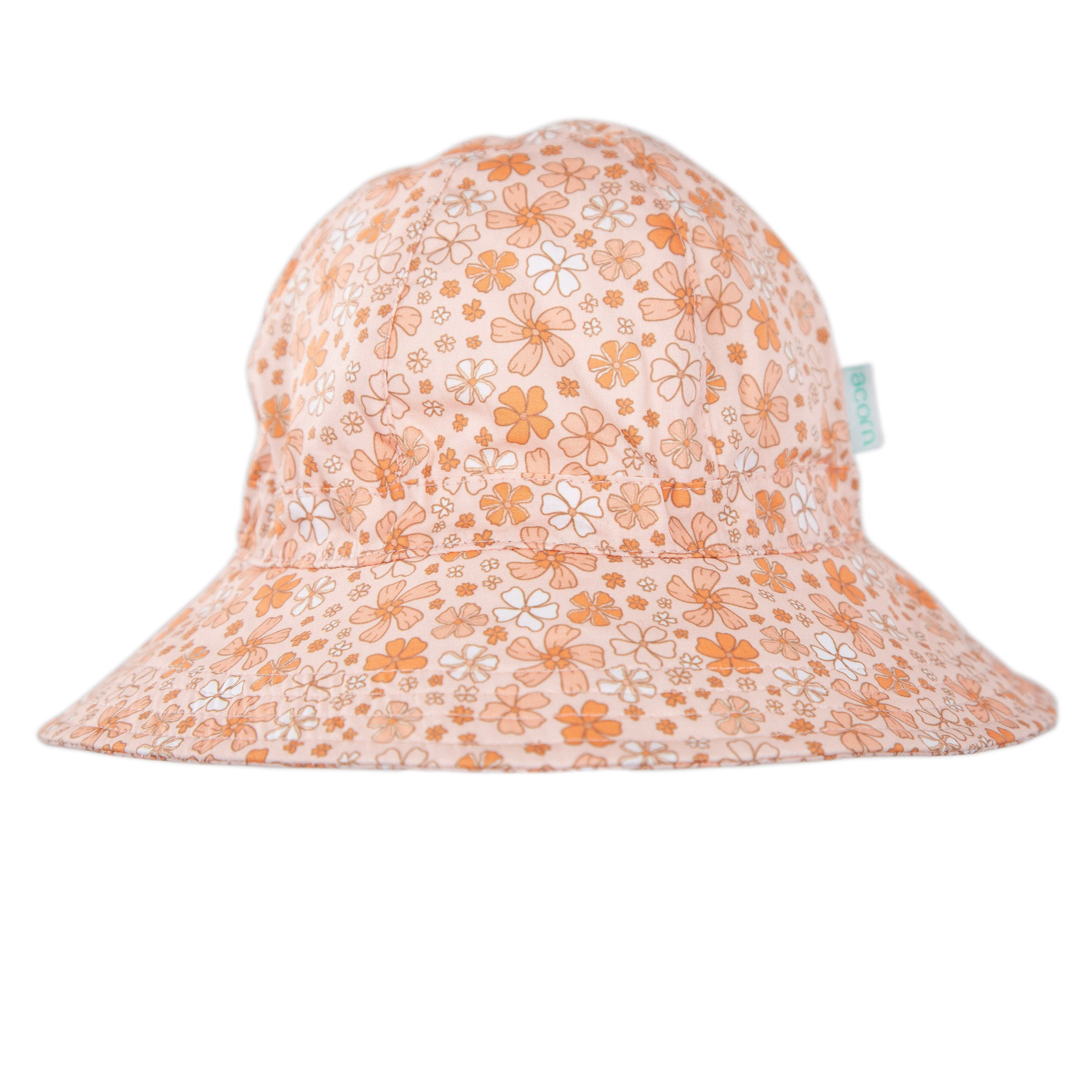 The ACORN KIDS Lulu Wide Brim Sunhat features a peach color and vintage orange-yellow floral print, offering UPF50+ sun protection. Shown on a white background.
