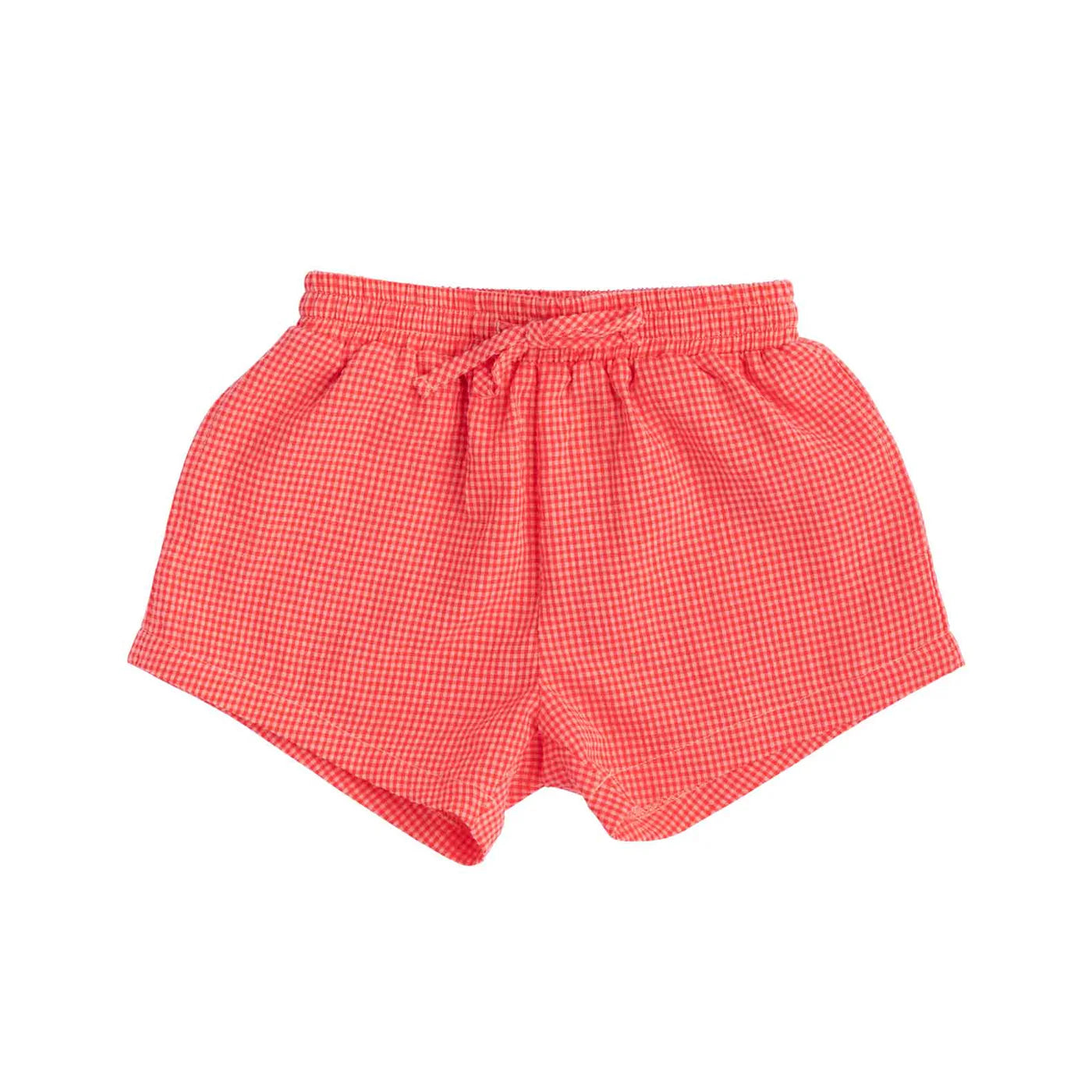 The Cami Shorts Cherry Gingham by LITTLE THE LABEL are red checkered unisex shorts made from soft seersucker cotton with an elastic waistband and drawstring, showcased on a white background emphasizing their simple, comfortable design.