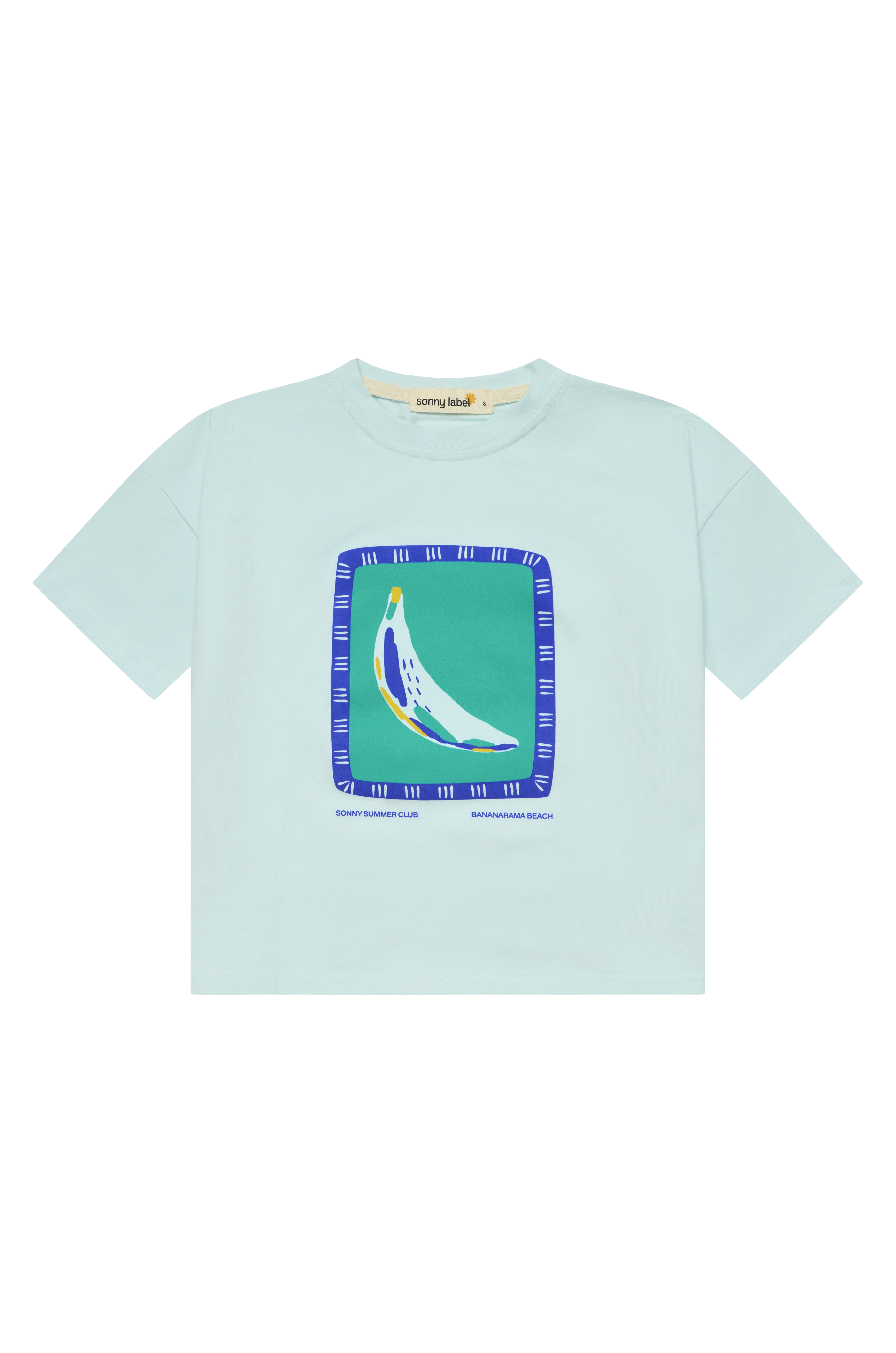 The Bananarama Tee Baby Blue, crafted by SONNY LABEL, features a bright graphic of a colorful banana inside a blue frame. The phrases "SONNY BUNNY CLUB" and "BANANARAMA BEACH" are prominently displayed on this soft cotton shirt set against a simple background.