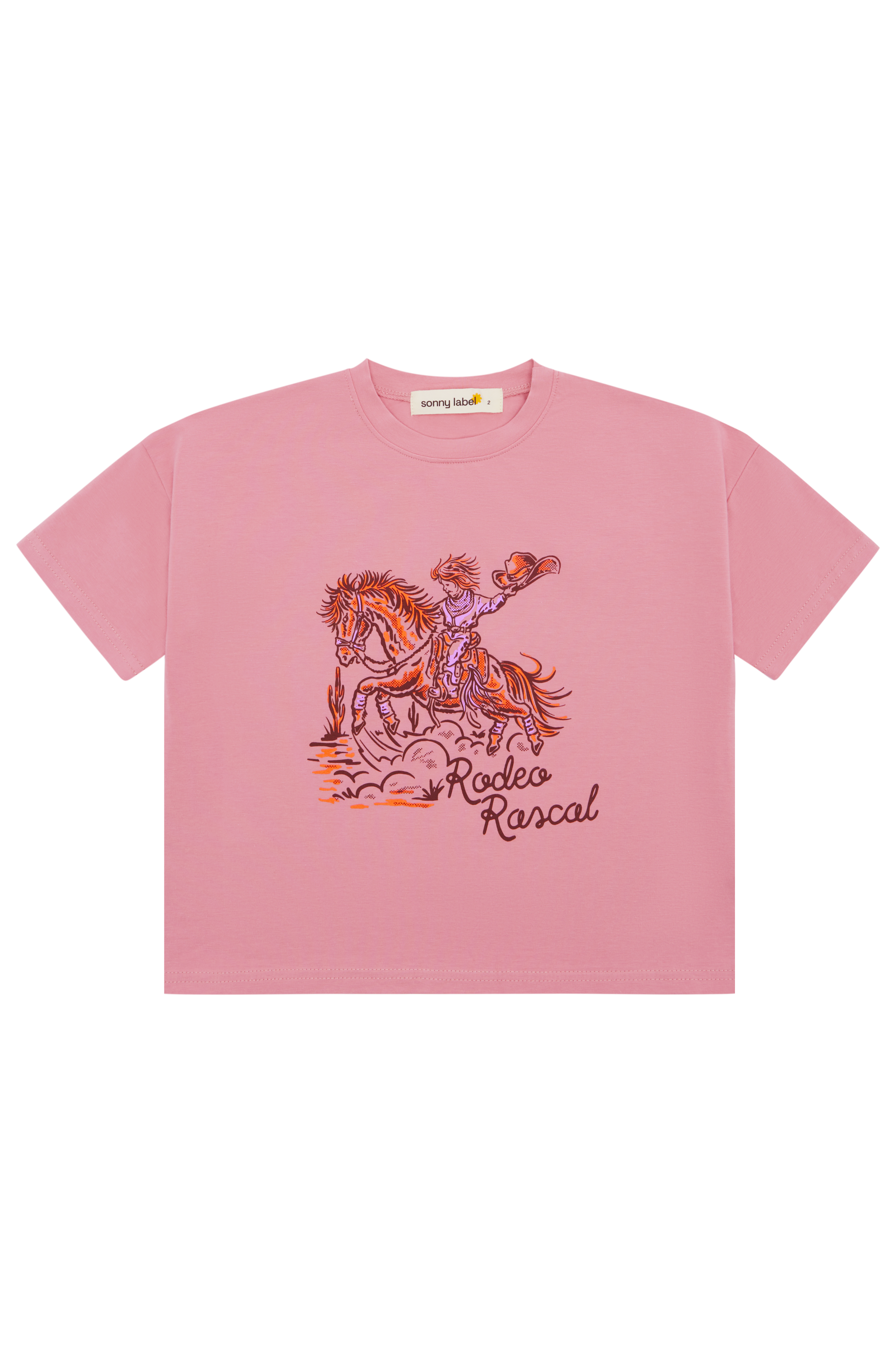 The 'Rodeo Rascals' Everyday Tee Salmon by SONNY LABEL is a pink cropped t-shirt made from a soft cotton spandex blend, showcasing a vibrant illustration of a cowboy riding a horse and featuring playful "Rodeo Rascals" text for added charm.