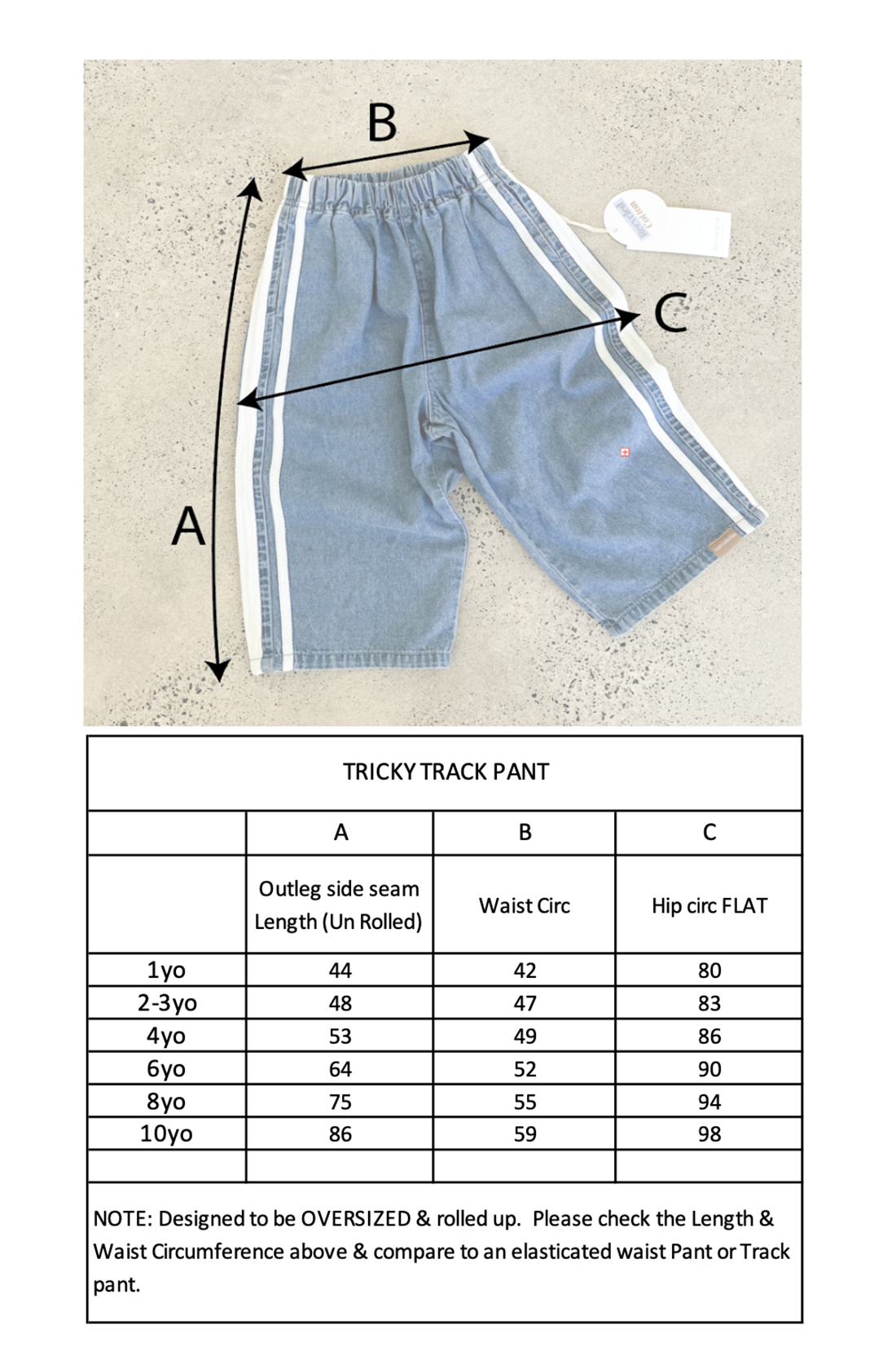 An image depicting a pair of Tricky Track Pants by TWIN COLLECTIVE against a gray background. The pants showcase white side stripes and a white waistband, embodying a vintage-inspired design. Measurements A, B, and C are indicated on the pants. Below is a chart titled "Tricky Track Pant" detailing size measurements from 1yo to 10yo.