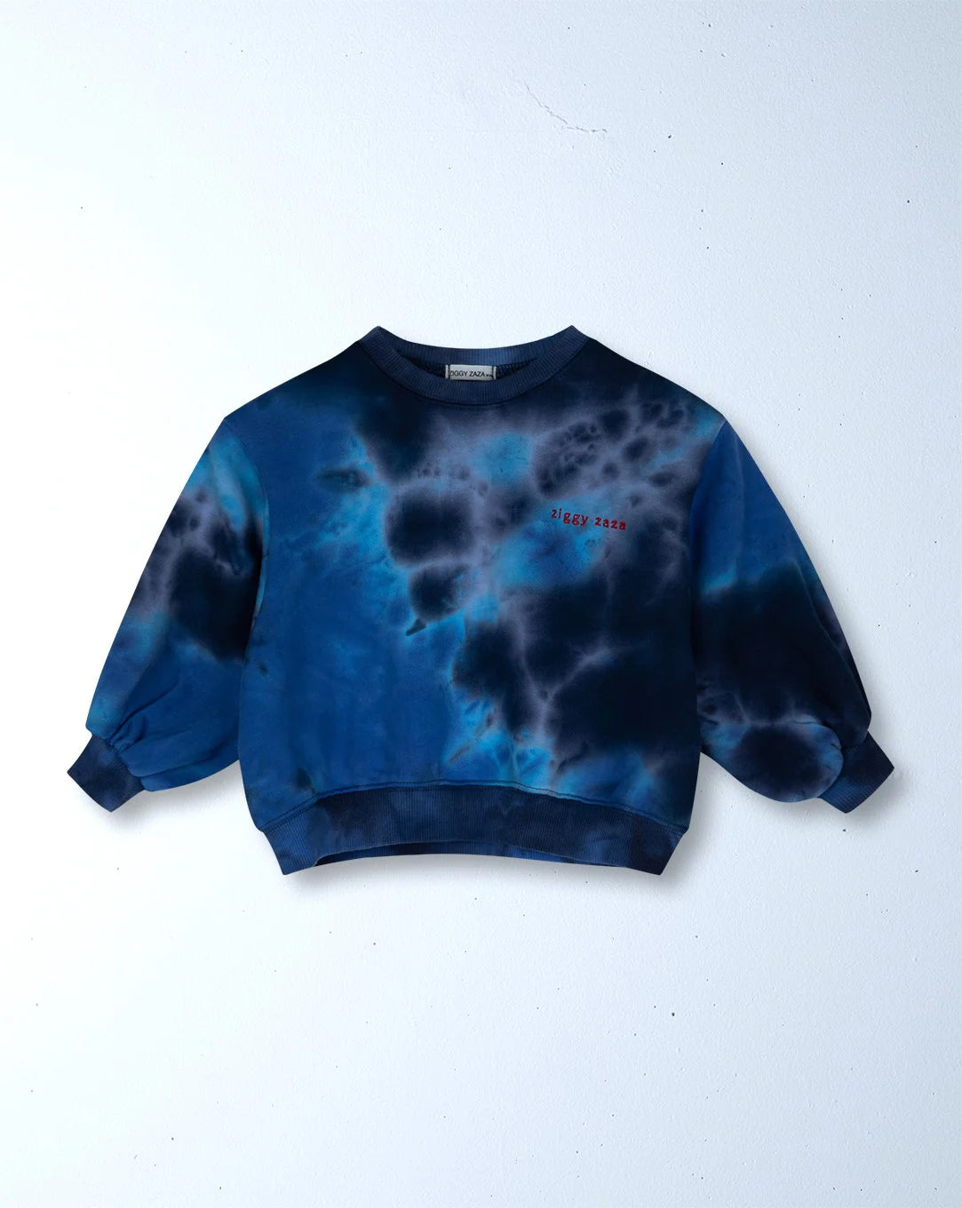 The Ziggy Zaza - Toro Dyed Pullover Ocean by ZIGGY ZAZA is a blue and black oversized 100% cotton fleece crew neck sweatshirt with balloon sleeves and "I stay zen" embroidered in red on the chest, shown against a plain white background.