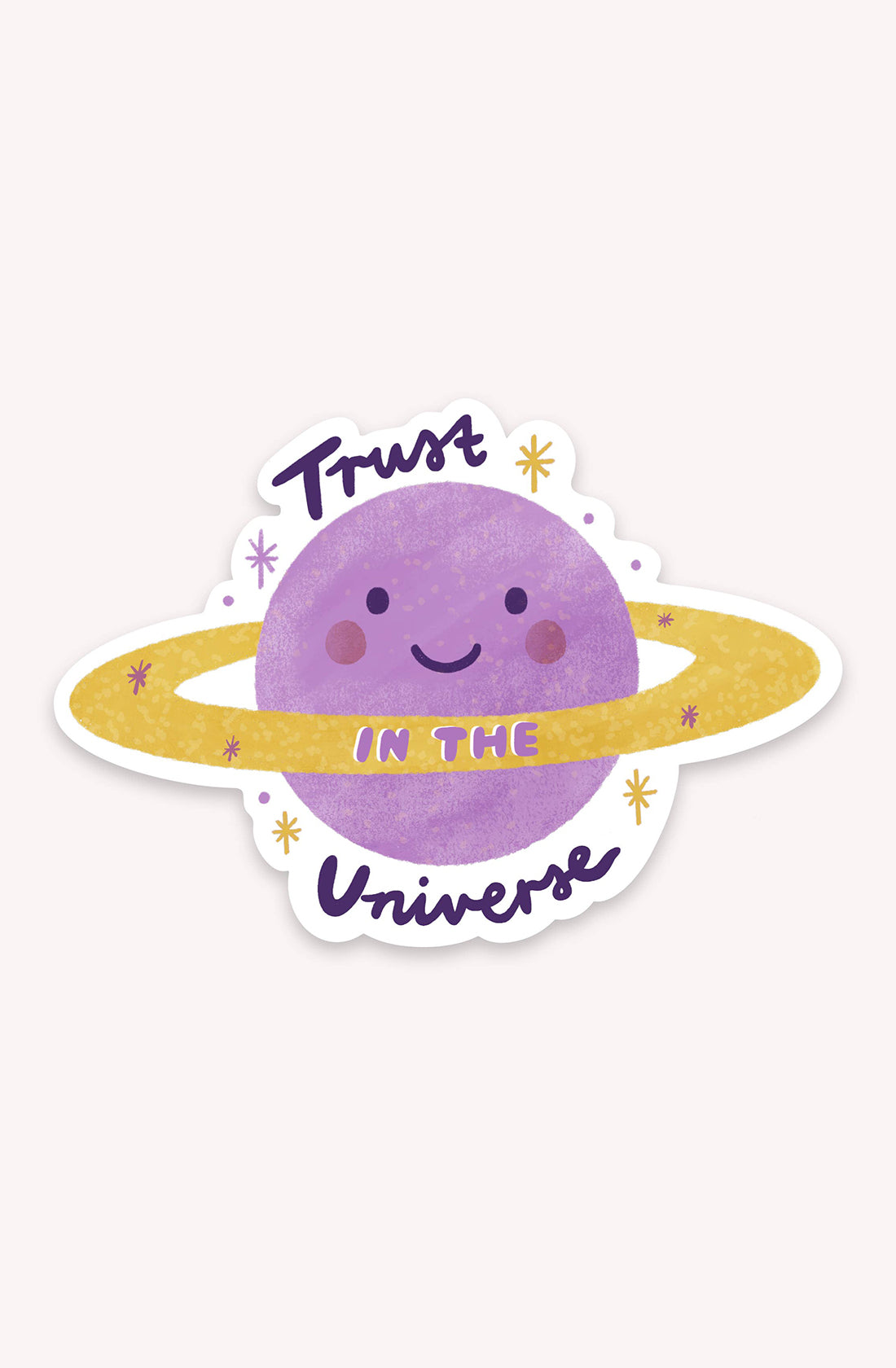 The "Trust in the Universe Sticker" from LAUREN SISSONS STUDIO showcases a cheerful, purple planet adorned with a golden ring and sparkles. The planet bears the message "Trust in the Universe," making it an ideal decorative choice for laptops or as a cosmic vinyl sticker. The background is off-white.