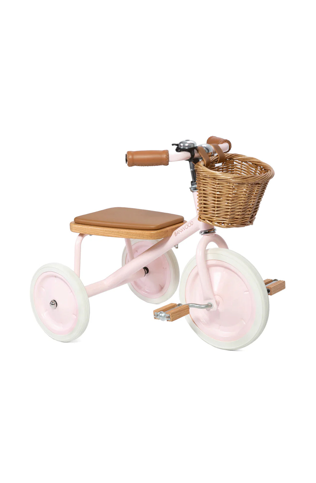 A 45 degree angle shot of a pink banwood trike with a straw basket.