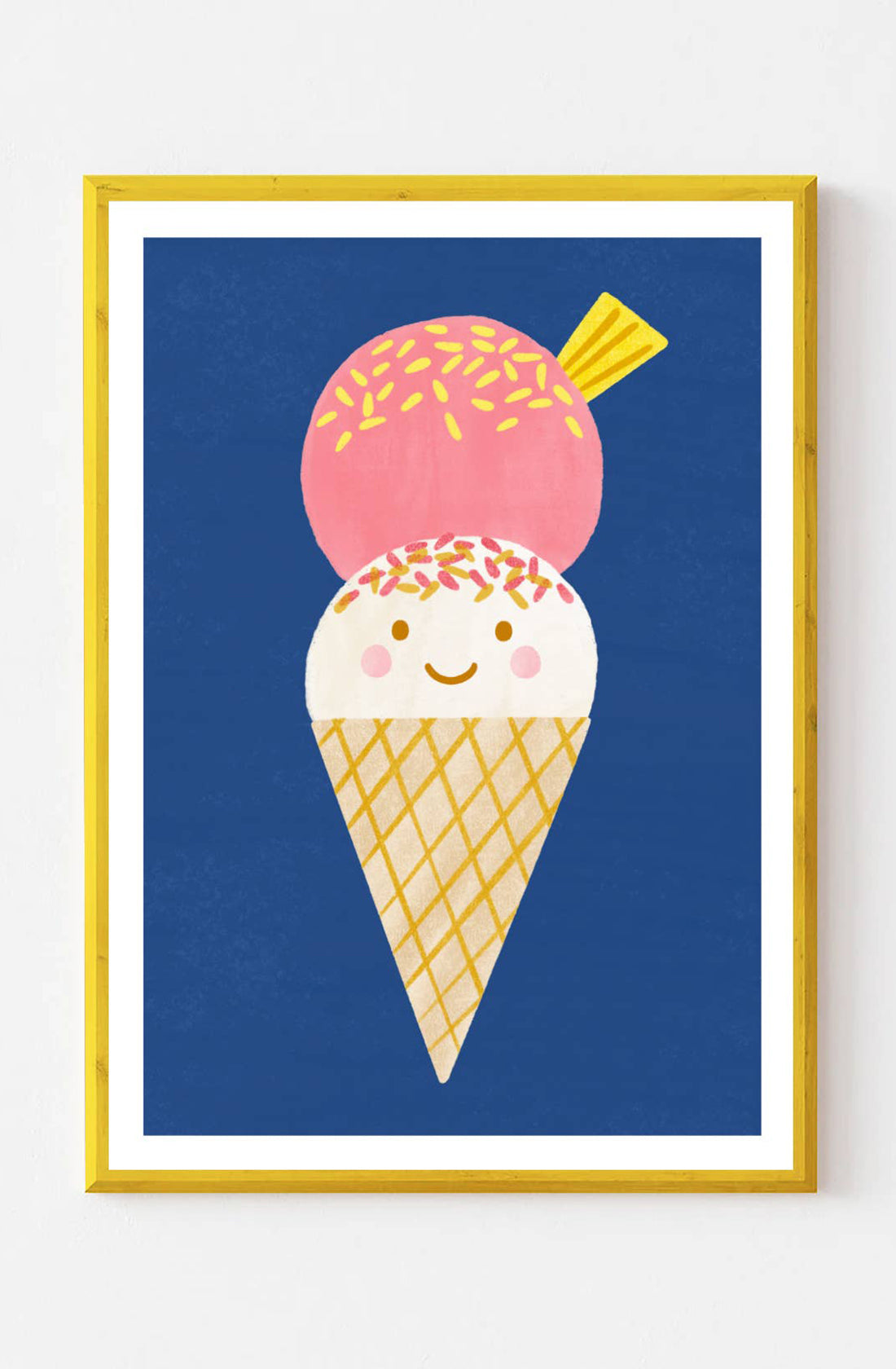 This Ice Cream Wall Art Print by LAUREN SISSONS STUDIO features a charming illustration of a cheerful ice cream cone with two scoops: one white with pink sprinkles and the other pink with yellow sprinkles. The contemporary artwork is framed with a yellow border and set against a blue background, printed on high-quality art paper.