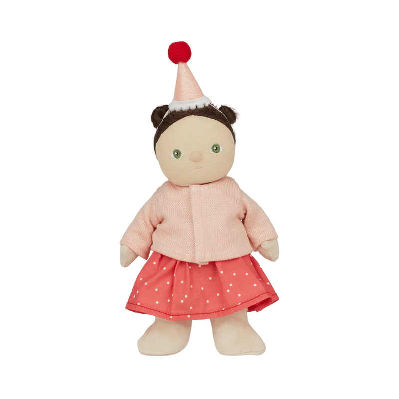 The Dress Me Dinky Sophia Sundae by OLLI ELLA features a cute posable doll in a pink cardigan, red polka dot skirt, and party hat with a red pom-pom. With green eyes and matching pink and red tones, it's perfect for creative play against a plain background.