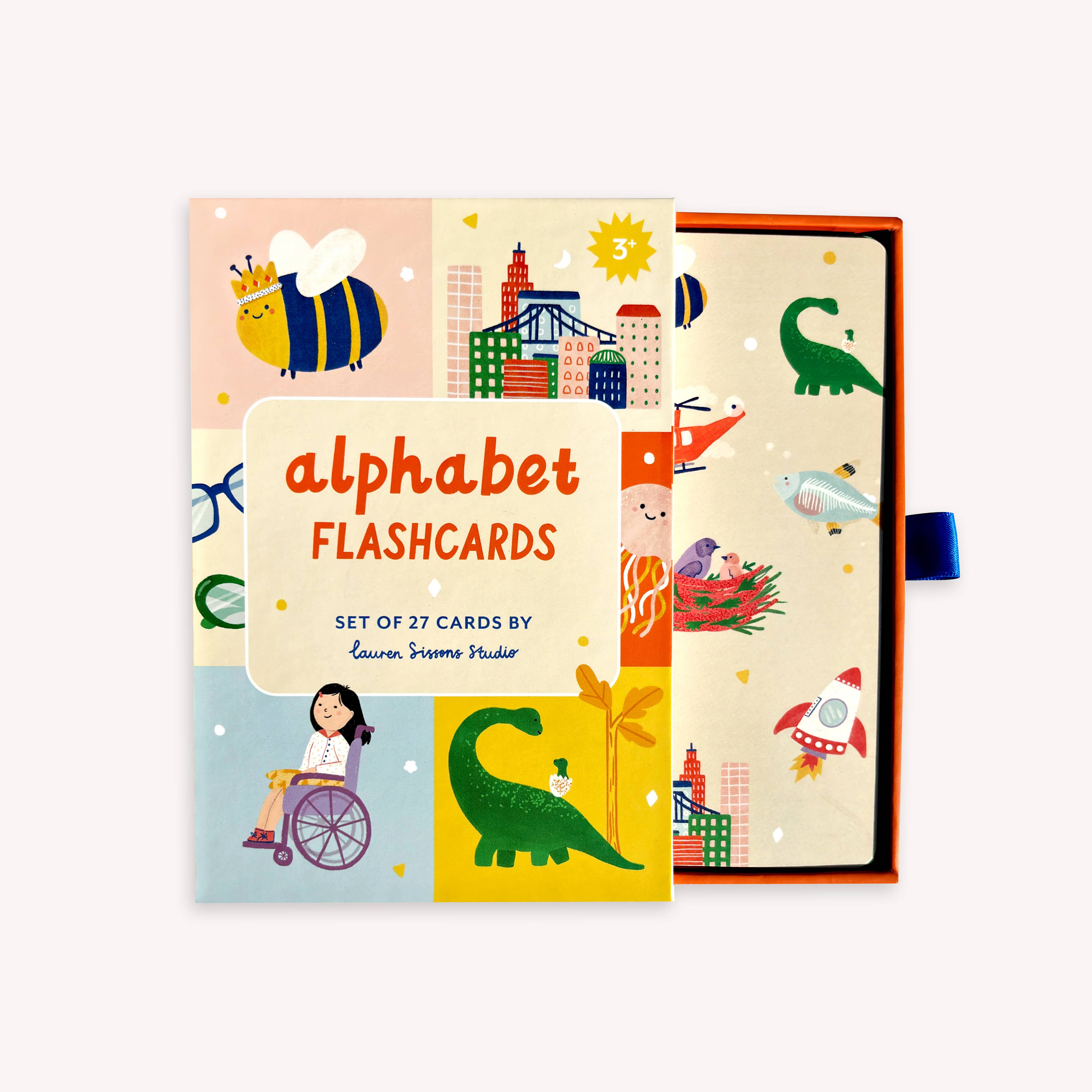 The A-Z Illustrated Alphabet Flashcards by LAUREN SISSONS STUDIO are a vibrant collection of educational tools designed for preschoolers. Each laminated card features colorful illustrations of animals, buildings, and various objects, with one card partially pulled out to showcase a dinosaur illustration. The set includes 27 cards and is part of the children's educational toys category.