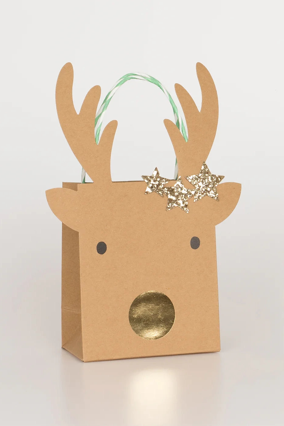 The MERI MERI Small Reindeer With Stars Gift Bags (Pack of 2) feature a design of a reindeer's face with antlers, highlighted by black eyes, a shiny gold nose, and a green and white striped handle. The decoration is completed with three gold glitter stars elegantly placed near one antler.