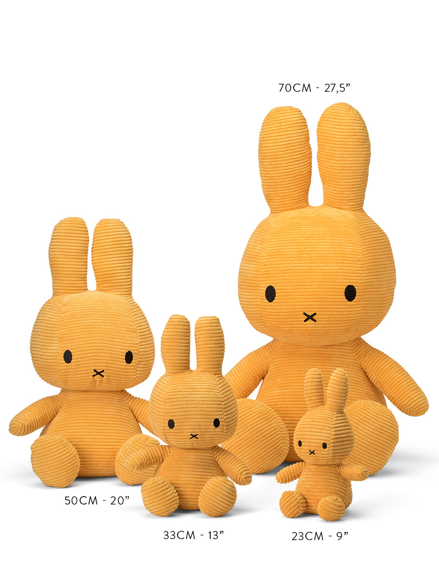 Four plush bunny toys from BON TON TOYS X MIFFY, resembling Miffy Sitting Corduroy, are lined up from smallest to largest. The sizes above them read 9 inches (23 cm), 13 inches (33 cm), 20 inches (50 cm), and 27.5 inches (70 cm). These cuddly gifts feature black eyes and noses.