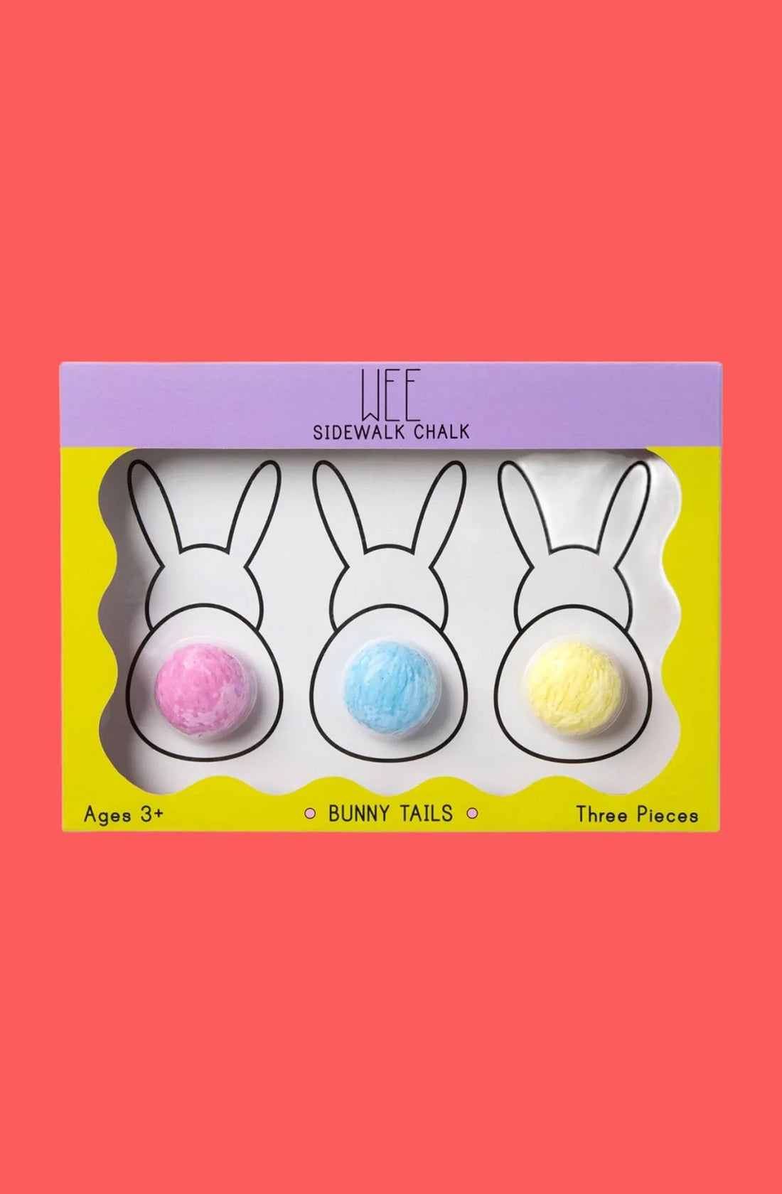 A box labeled "Bunnytails Sidewalk Chalk" by TWEE containing three pieces of Limited Edition Bunny Tails chalk. Each piece is round and textured like a pom-pom, with colors pink, blue, and yellow. Perfect as a gift for little ones, the non-toxic washable chalk comes in a box with a yellow and purple border featuring bunny silhouettes.