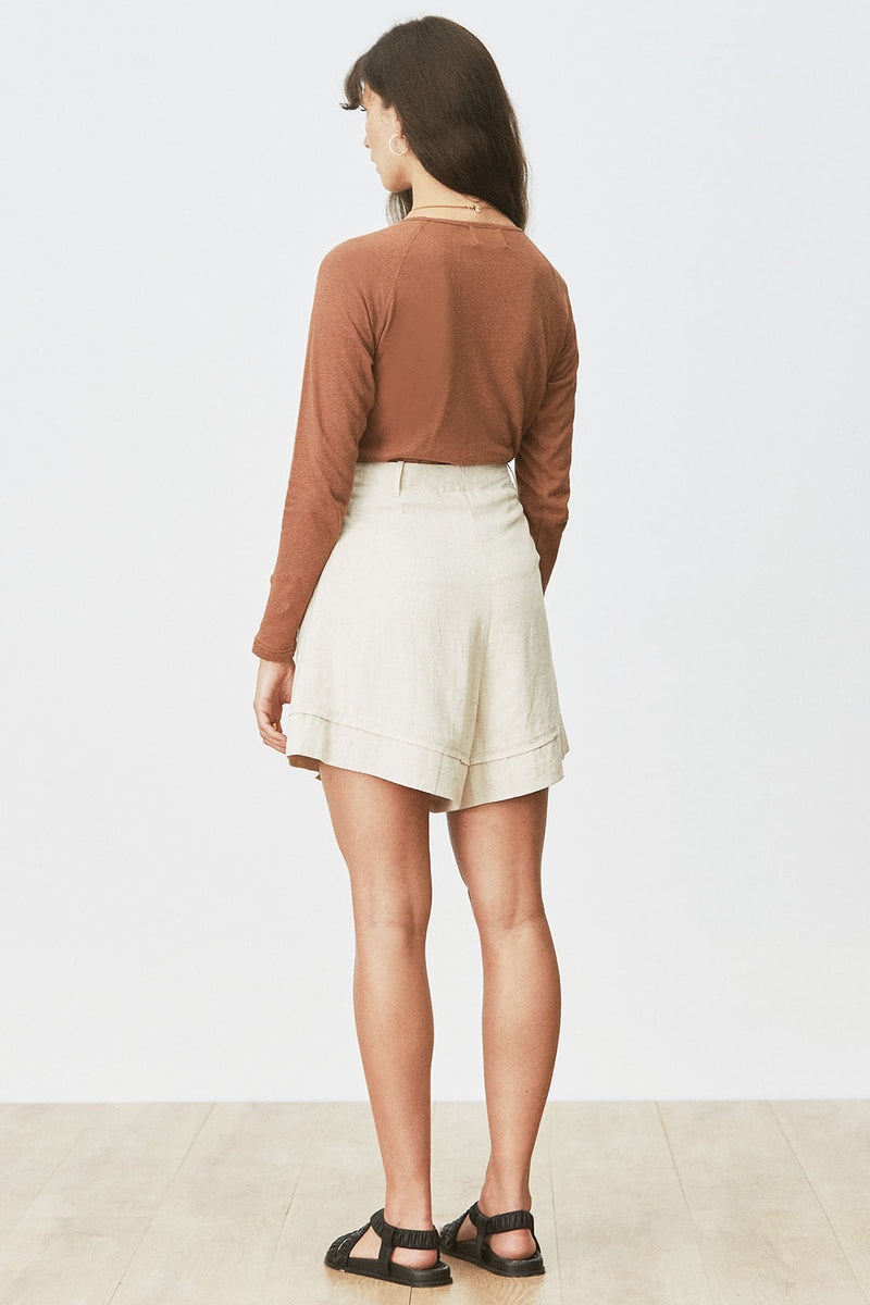 Rear view of woman wearing Cora Tee in Toffee with cream short