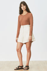 Front view of woman wearing Cora Tee in Toffee with cream short