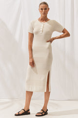 Woman wearing Isabella Dress in Off White. Full length, front view.