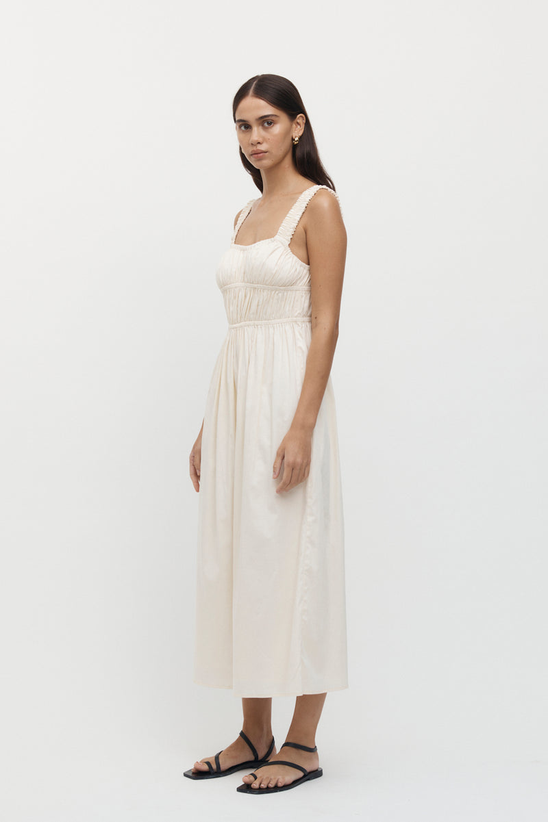 Side view of woman wearing Axel Elastic Ruched Dress in creme.