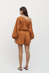 Rear view of woman wearing Viviers Off Shoulder Top with matching shorts in marmalade.