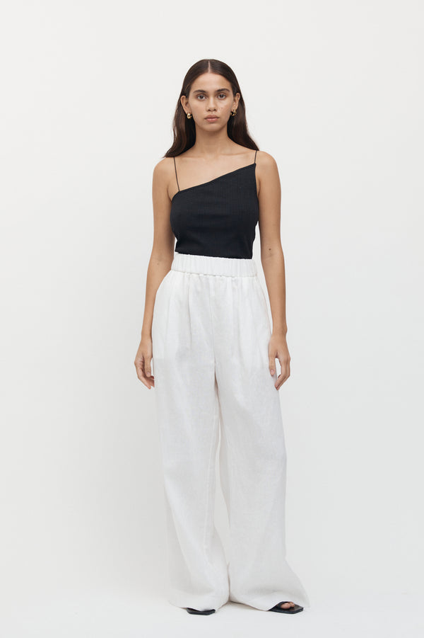 Full length view of woman wearing Sete Linen Elastic Waist Pant in white.