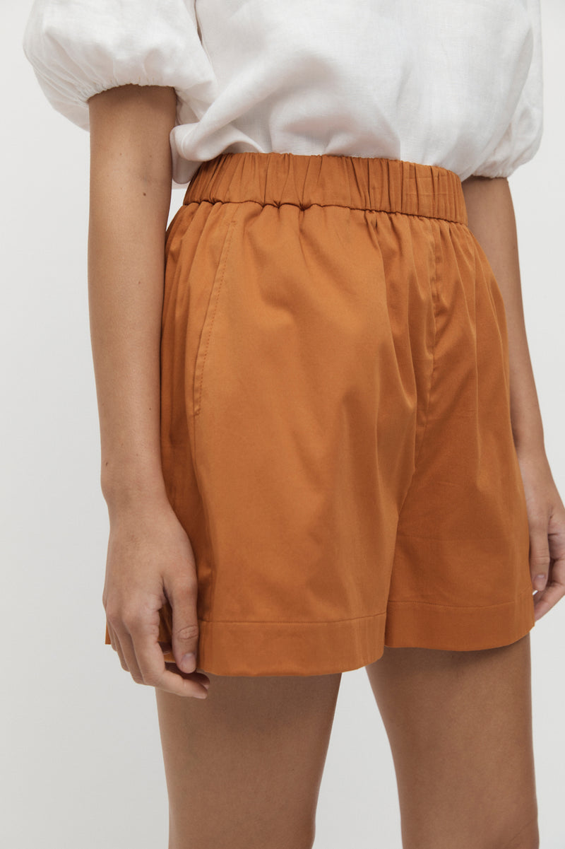 Close up of Viviers Elastic Waist Shorts in marmalade.