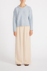 Front view of woman wearing Mika Jumper with wide leg pants.