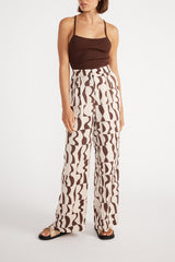 Front view of woman wearing Muse Wide Leg Pant with brown cami.