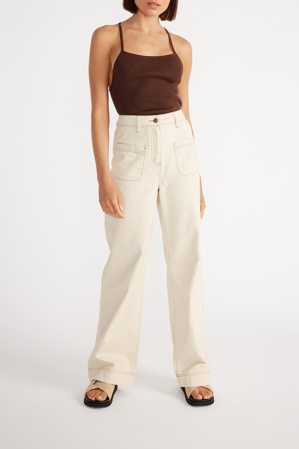 Front view of woman wearing Kinsley Wide Leg Jean with a brown cami.