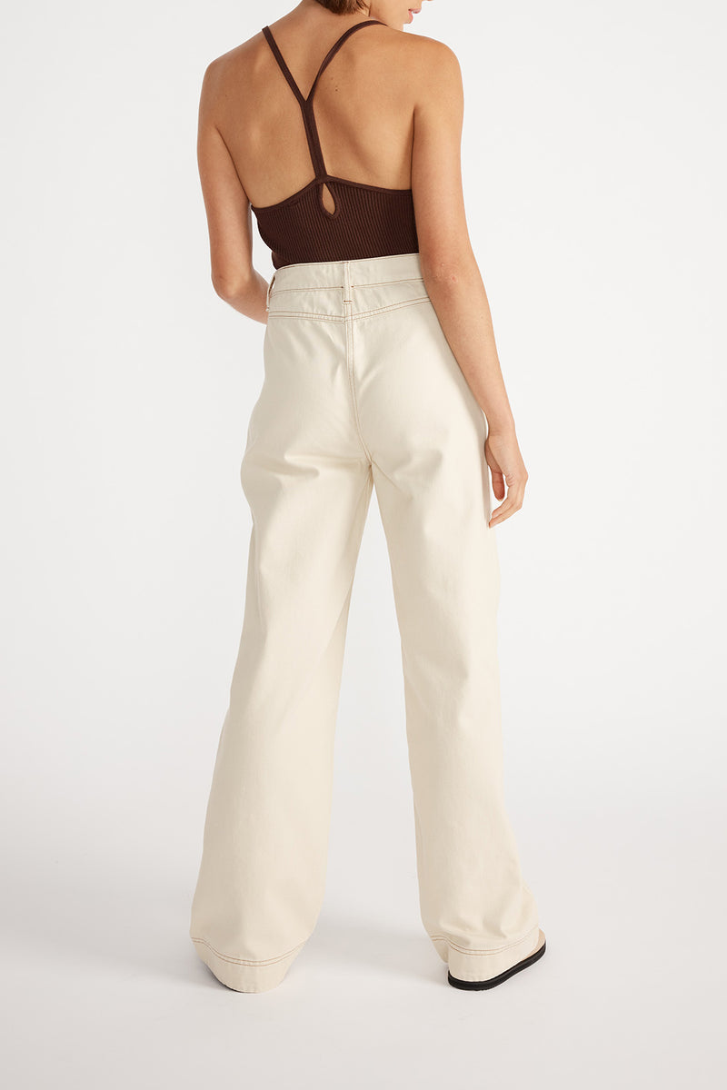 Rear view of woman wearing Kinsley Wide Leg Jean with a brown cami.