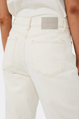 Close up of back pocket details of cream jeans